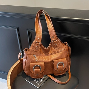 Vintage brown leather tote bag with multiple pockets and silver ring details