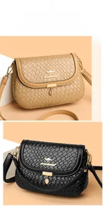 Close-up of woven texture flap bags with golden leaf pendant and kangaroo logo