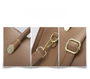 Detailed views of brown litchi leather texture and golden metal strap buckles on the handbag