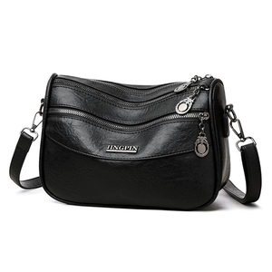 Borsa a tracolla in pelle PU nera con cerniere multiple e logo in metallo argento