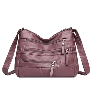 Deep burgundy multi-pocket soft leather shoulder bag with adjustable strap and zippers
