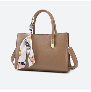 Brown faux leather handbag with textured finish and decorative floral silk scarf
