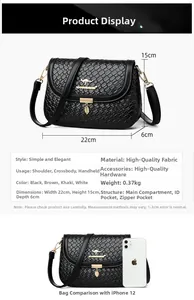 Detail view of woven texture crossbody bag with size specs 22x15x6cm and gold leaf pendant