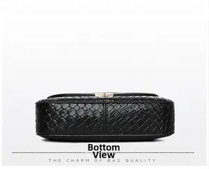 Bottom view showing the wide woven texture base and precise stitching of the black bag