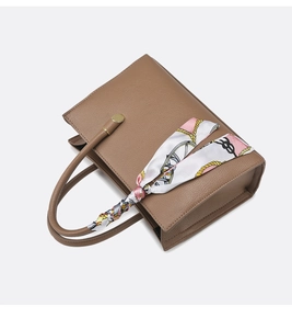 Brown faux leather handbag featuring lychee texture and a stylish printed silk scarf