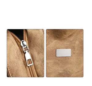 Detail of high quality khaki canvas fabric with silver metal zipper and decorative plate