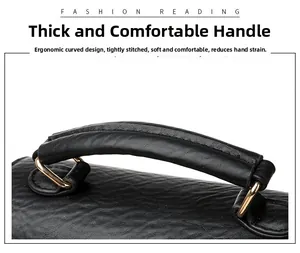 Detail of ergonomic black leather handle with golden D-ring and tight stitching
