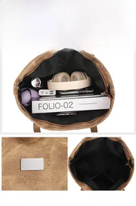 Macro view of spacious brown tote bag interior with zipper pocket and metal detail