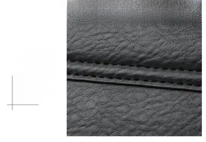 Close-up of black lychee texture leather with precise double-row parallel stitching