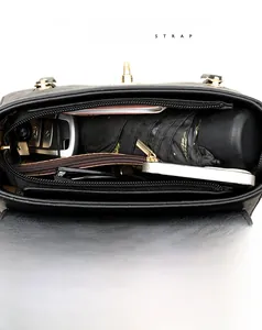 Interior view showing organized storage capacity for daily essentials in black shoulder bag