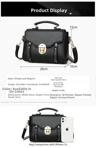 Detail view of black lychee leather bag with dimensions 20x15x10cm and gold hardware