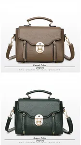 Detail view of retro small square bags with lychee texture and gold twist locks
