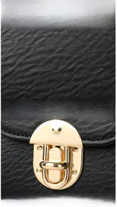 Detail view of premium lychee texture leather and elegant gold metal oval clasp