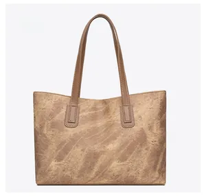 Back view of a large vintage brown tote bag with retro marble texture and dual shoulder straps