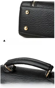 Detail of lychee textured handbag showing golden metal rivets and padded handle