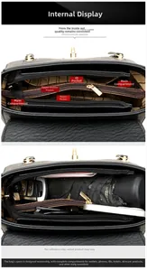 Detail view of the black leather bag multi-layer interior with functional compartments