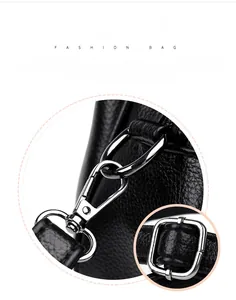 Detailed macro view of silver metallic buckle and textured lychee pattern leather