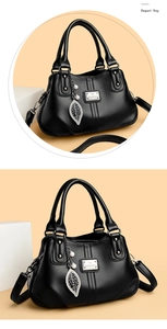 Detail of black lychee leather handbag featuring metal leaf pendant and pearl charm