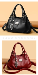 Close-up of black and burgundy leather handbags with leaf charms and pearl details