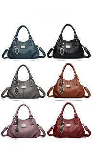 Color display of soft leather handbags in six variants with metallic leaf pendants