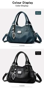 Detail of blue and black leather handbags with litchi texture and metal kangaroo logo