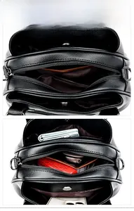 Internal display showing multi-layer compartments and zip pockets of the black leather bag