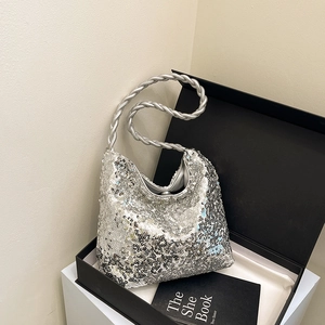 Silver sequin hobo handbag with braided handle in a luxury gift box setting