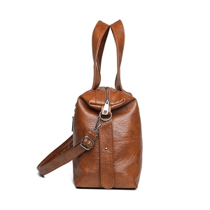 Brown vintage large capacity PU leather handbag with adjustable strap in side view