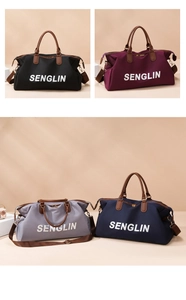 Detail view of large capacity travel bags in four colors with durable leather handles