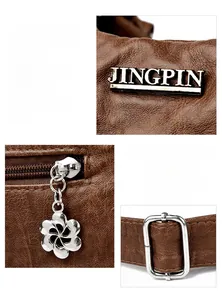 Close-up of brown litchi pattern leather details with silver floral zipper pulls