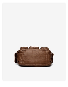 Detail of the wide reinforced base and precise stitching on the brown vintage bag