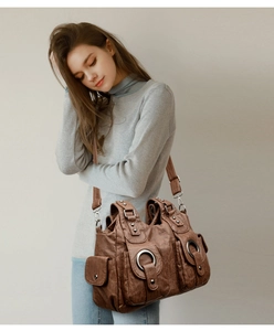 Brown vintage faux leather tote bag with metal ring and adjustable shoulder strap
