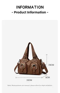Detail view of brown pebbled leather handbag with metal rings and size info: 33x29x9cm