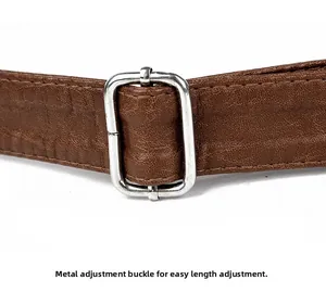 Detail of adjustable silver buckle on a dark brown leather shoulder bag strap