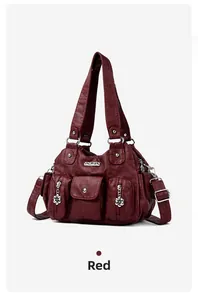 Detail view of burgundy handbag with floral charms and multiple utility pockets