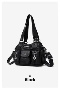 Close-up of black retro PU leather bag with multi-pocket design and floral zipper pulls