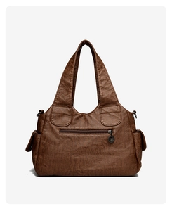 Detailed view of brown vintage oil-wax leather tote with multi-pockets and front zipper