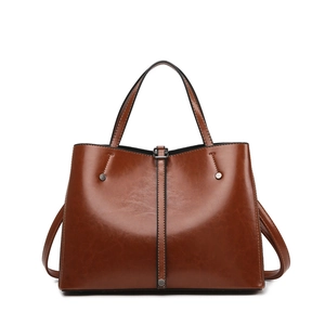 Retro brown glossy tote bag with dual handles and silver rivets on white background