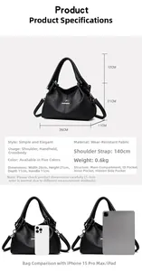 Detail view of black lychee texture leather handbag with 26x21x11cm dimensions and logo