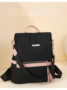 Detail of pink and black anti-theft backpack with water-resistant fabric and zippers