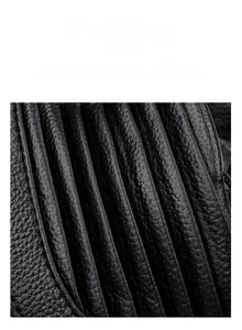 Close-up of black wear-resistant fabric with lychee texture and ribbed pleat detail