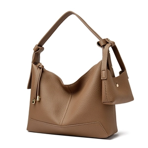 Brown litchi grain leather hobo bag with wide shoulder strap and matching mini coin purse
