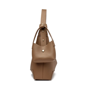Brown lychee leather handbag with gold rivets and mini pouch, side view profile