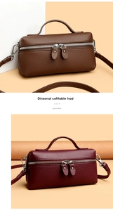 Detail view of lychee pattern leather handbag with dual zippers and adjustable shoulder strap