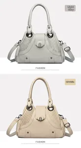 Detail showing litchi grain leather texture and horseshoe buckle on side pleated bags