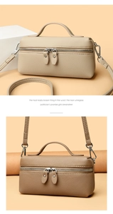 Detail of lychee pattern leather box bag with double zippers and metal hardware hooks