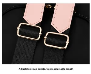 Close-up of adjustable backpack shoulder straps with rose gold metal buckle and leather trim