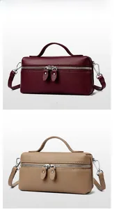 Vertical view of pebbled leather box bags in burgundy and beige with top handles