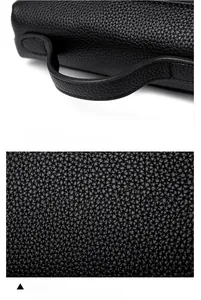 Detail of soft black lychee pattern leather and reinforced handle for elegant handbag