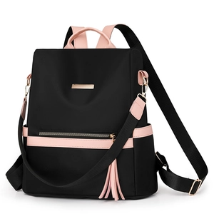 Versatile black water-resistant nylon backpack with pink handles and detachable strap